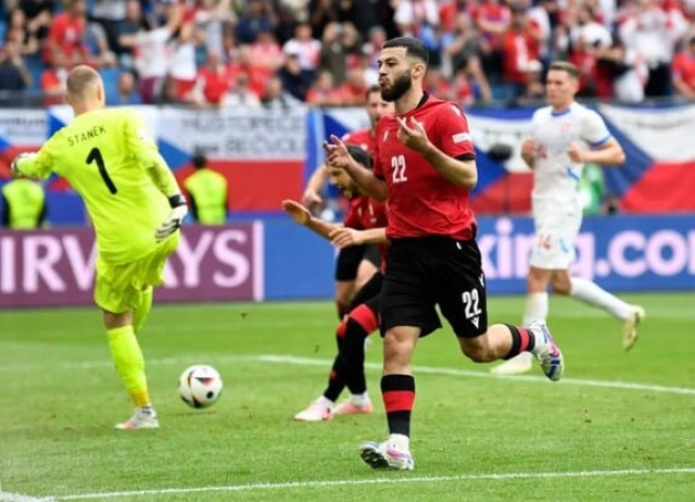 Mikautadze celebrates scoring their first goal against the Czech Republic at Euro 2024