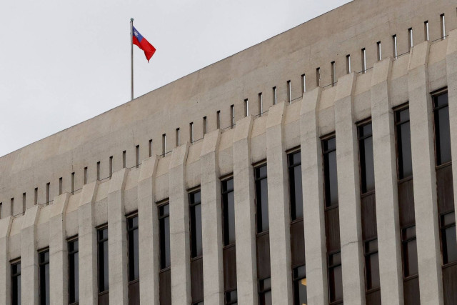 Taiwanese flag is seen on top of Taiwan's central bank in Taipei, Taiwan, December 14, 2022