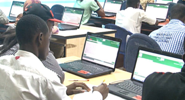 Students writing JAMB