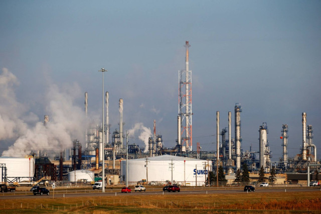 Petrochemical storage tanks are seen at the Suncor Energy chemical plant near Edmonton, Alberta, Canada, October 7, 2021.